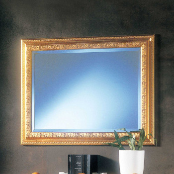 Specchiera dorata con cornice intagliata e specchio molato