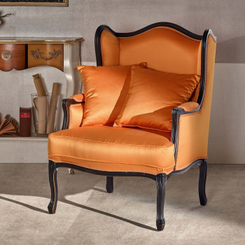 Poltrona bergere imbottita in tessuto arancione, dettagli intagliati