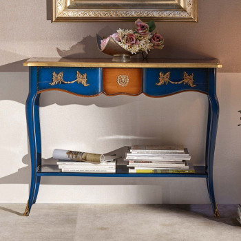 Consolle classica con fregi in metallo e gambe a sciabola