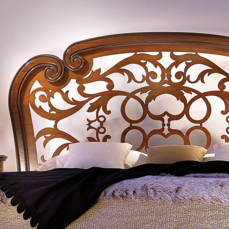 Letto 'Opera' con testata traforata floreale in legno