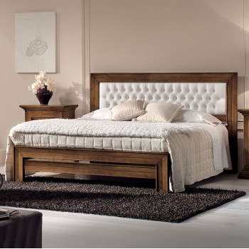 Letto con testata imbottita a capitonnè in ecopelle