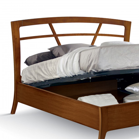 Letto matrimoniale con testata traforata e contenitore aperto