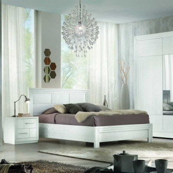 Letto con testata legno in una camera elegante