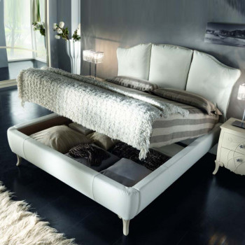 Letto imbottito con contenitore e piedini intagliati