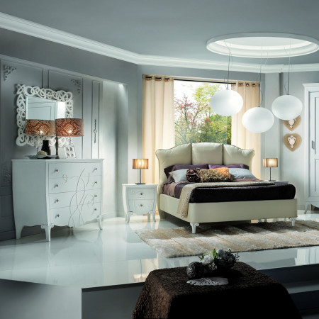 Letto imbottito con contenitore, dettagli piedini intagliati