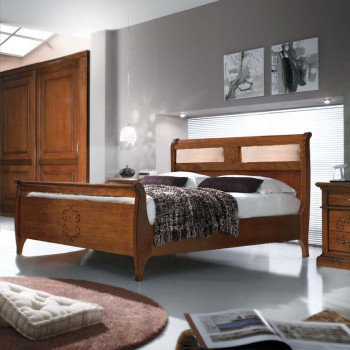 Letto con testata imbottita, dettaglio legno
