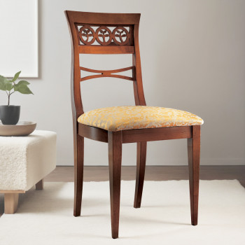 Sedia con gambe a spillo e seduta imbottita in tessuto