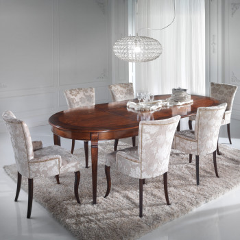 Tavolo ovale con intarsio floreale allungabile ambientato