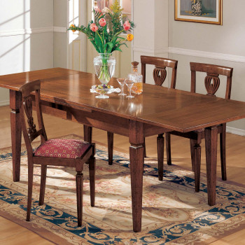 Tavolo quadrato allungabile noce ambientato in soggiorno