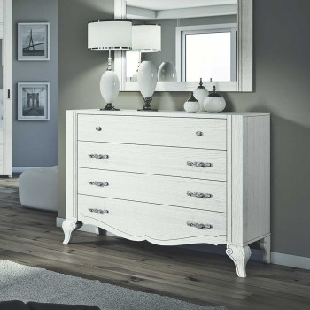 Comò 4 cassetti lisci con frontale sagomato in camera da letto moderna