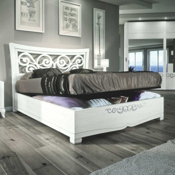 Letto testata traforata e contenitore con dettagli floreali