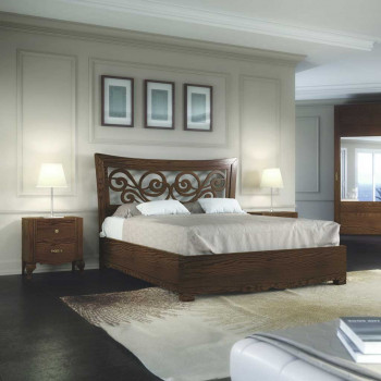 Letto sagomato in legno con testata traforata