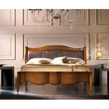 Letto matrimoniale in legno con testata imbottita