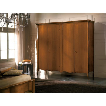 Armadio 4 ante sagomato in legno noce in camera