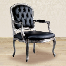 Poltroncina capitonnè dettaglio tessuto e gambe in legno