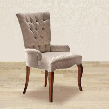 Poltroncina capitonnè dettaglio tessuto e gambe in legno