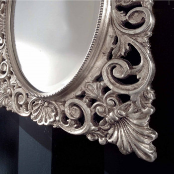 Specchiera centro ovale foglia argento con dettagli barocchi