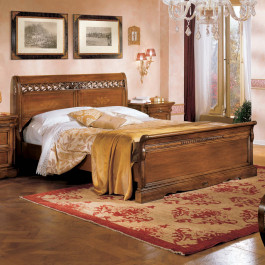 Letto con pannelli in ecopelle capitonè e legno toulipier