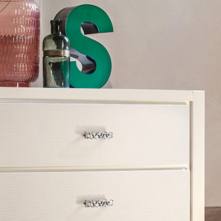 Comò bombato sei cassetti con dettaglio decorativo