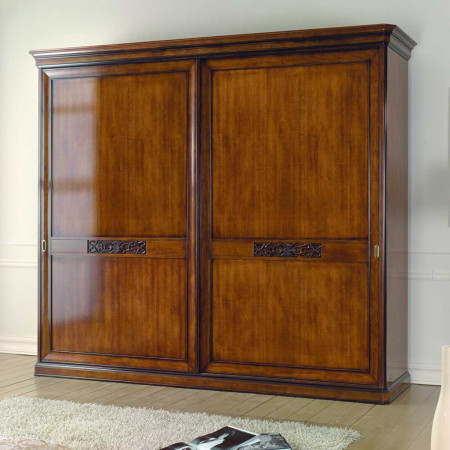 Dettaglio del letto con testata intagliata, legno