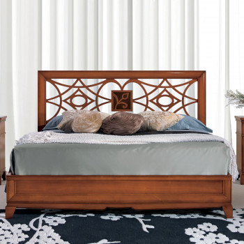 Letto disegno geometrico, testata intagliata a motivi