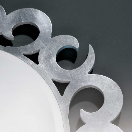 Dettaglio della specchiera rotonda specchio molato, design vortice