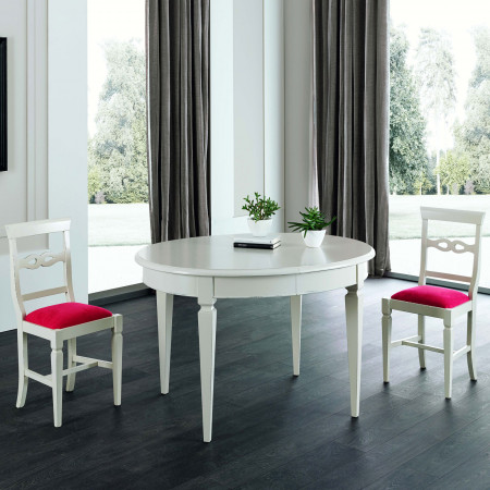 Tavolo ovale allungabile 130x105, ambientato con sedie