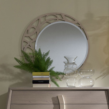 Specchiera tonda traforata in legno con decorazione