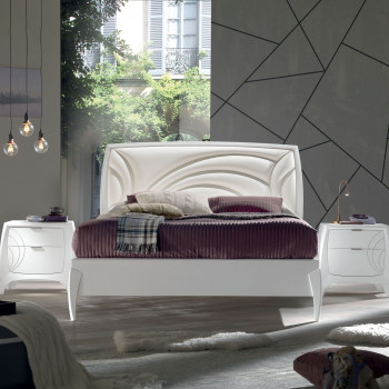 Letto matrimoniale curvo con testata imbottita in ecopelle