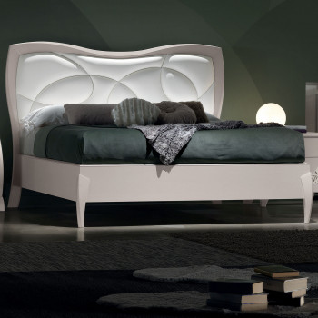 Letto matrimoniale sagomato con imbottitura e testata illuminata