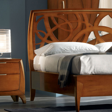 Letto matrimoniale curvo con testata traforata legno noce