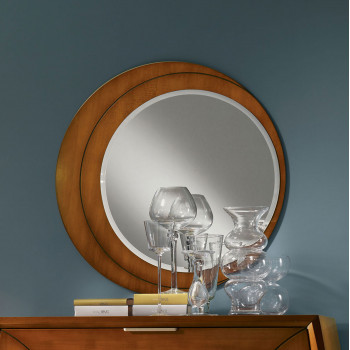 Specchiera rotonda incisa su mobile in legno