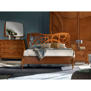 Camera da letto contemporanea con testiera intagliata