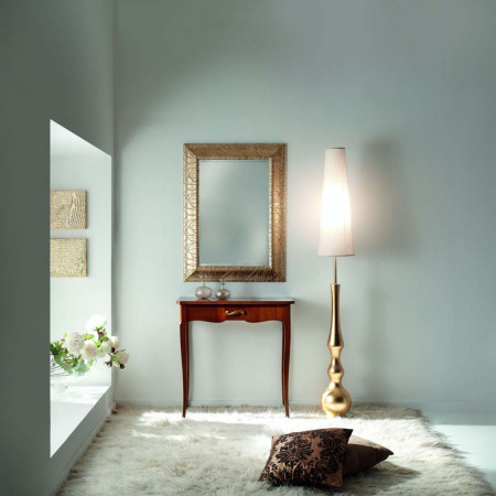 Specchiera dorata con cornice intagliata e vetro molato