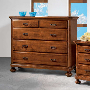 Comò classico in legno con dettagli di piede tornito