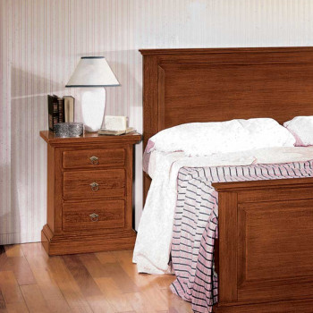 Comodino legno nuovo, tre cassetti, accanto a letto