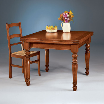 Tavolo a tiro allungabile in legno massello con dettaglio gamba