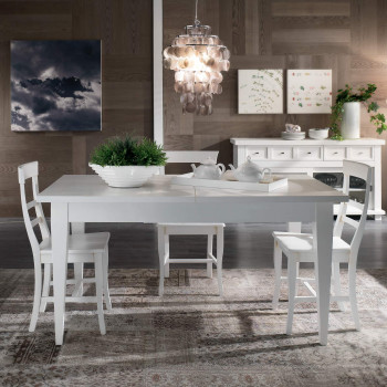 Tavolo con gambe a spillo allungabile ambientato, dettaglio bianco