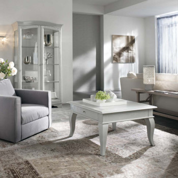 Tavolino quadrato gamba curva con piano sporgente