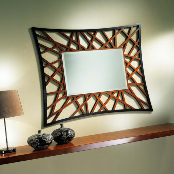 Specchiera traforata con specchio molato su parete