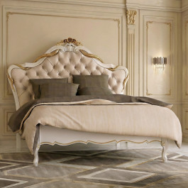 Letto Vienna in legno intagliato con testiera capitonnè