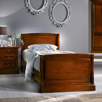 Letto una piazza in legno massello con testata sagomata