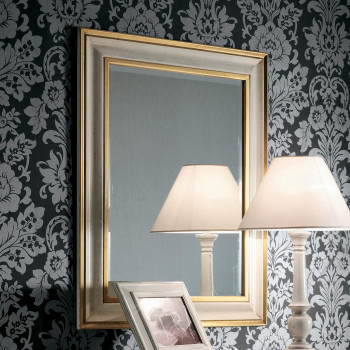 Specchiera laccata bianco e oro con dettaglio cornice