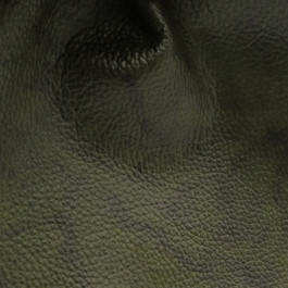 Pelle verde Vintage, dettaglio superficie irregolare Pelle verde tamponata a mano con effetto Vintage dettaglio