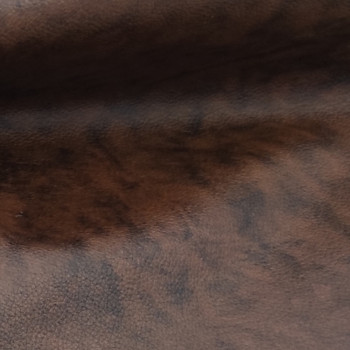 Pelle marrone tamponata a mano, dettaglio effetto Vintage