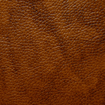 Dettaglio pelle arancione effetto vintage tamponata a mano