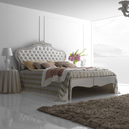 Camera da letto classica contemporanea con testiera capitonné